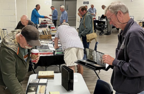 Members inspecting offers